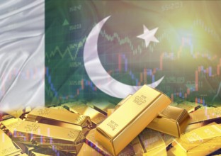 Gold bars on Pakistan flag in background. Gold bars stacked on Pakistani flag. Concept of Pakistan