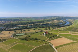 Pilgrimage church Maria im Weingarten, in a wide landscape of vineyards and fields along a large