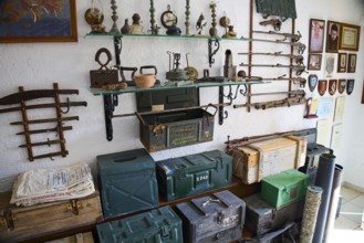Shelves with antique weapons, lamps and crates in a military museum, war museum, military museum,