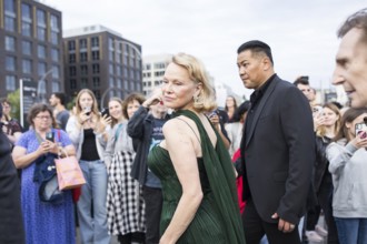 Pamela Anderson attends the film premiere of The Naked Gun at the UCI Luxe East Side Gallery,