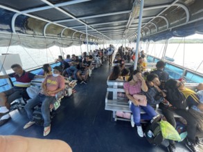 Ferry between Cebu and Negros, passengers on the upper deck, Philippines