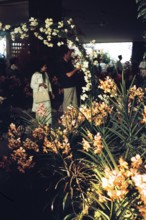 People attending flower show at the Singapore Turf Club, The 4th World Orchid Conference,