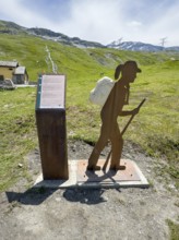 Information board on the left next to the Alpine Pass border pass road on early history and pass