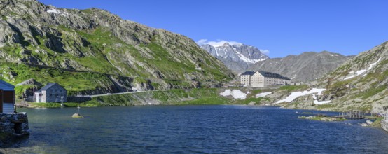 Panoramic photo of mountain lake Alpine lake Lac du Grand Gd Saint St Bernard, on the left Swiss