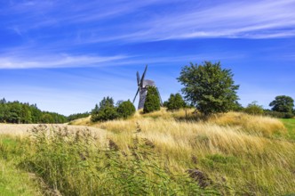 Historic windmill in an epic summer landscape near the burial ground of Stenhusbacken and the