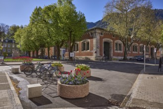 Historic buildings, bicycle stand, bicycle, flower pots, trees, backlight, blue sky, cloudless,