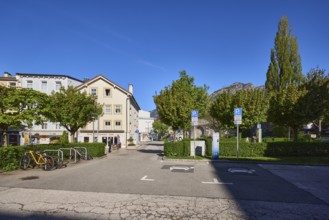 Car park, houses, building, car park, bicycle stand, bicycle, trees, hedge, blue sky, cloudless,