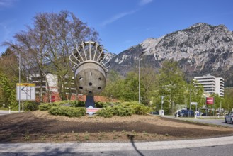 Saltworks roundabout, stainless steel sculpture, salt shaker, trees, lantern, mountains, general