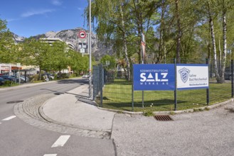Südwestdeutsche Salzwerke AG, Bad Reichenhall salt works, metal fence, advertising sign, trees,