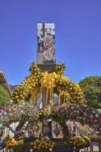 Easter fountain, Easter decoration, blown out coloured Easter eggs, trees, historical buildings,