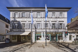 Kur-Apotheke, historical pharmacy, building, flagpoles, flags, facade, windows, entrance, doors,