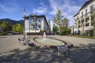 Wisbacherbrunnen, fountain, pedestrian zone, general architecture, cobblestones, flagpoles, flags,
