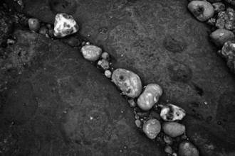 Pebbles, stones, pebbles on the beach, black and white, Yport, chalk cliffs, alabaster coast, La