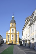 Baroque cruciform church with green carpet, houses, stony path, Suhl, Franconia, Thuringia, Germany