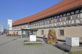 Entrance to the arms museum built in 1668, half-timbered house, banner, museum, Suhl, Franconia,