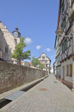 Half-timbered houses with rivulet and St George's Church, Bächle, Bächlein, churchyard,