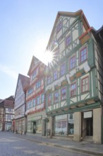 Red, green and brown half-timbered houses against the light, colourful, Auer Gasse, Schmalkalden,