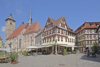 Late Gothic St George's Church and half-timbered houses with pedestrians, Altmarkt, Schmalkalden,