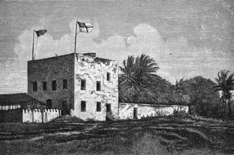 German station house in Bagamoyo, square building, former colony German East Africa, German flag,