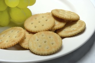 Crackers, crackers with grapes on a plate