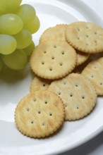 Crackers, crackers with grapes on a plate