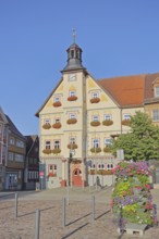 Market square with floral decoration and town hall, Schleusingen, Thuringia, Germany