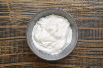 Overhead view of a bowl with sour cream or greek yoghurt