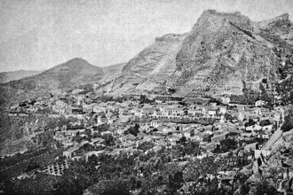 View of the ancient city of Taormina with the surrounding mountains, gardens, Sicily, Italy,