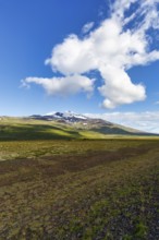 Barren volcanic landscape with a view of the snow-covered Snæfellsjökull volcano, Snäfellsjökull,