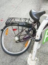 Deformed rear wheel of a bicycle in Vienna, Austria