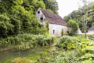 Old barn. The building is located near the source of the Zwiefalter Ach river at the Wimsen Cave