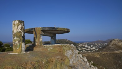 An abandoned concrete structure on a hill with a sweeping view over a cityscape, Lost Place, Lago