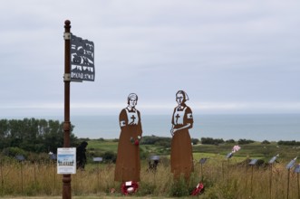 Nurse Mollie Evershed and Dorothy Field, installation, sign Gold Beach, Standing with Giants,