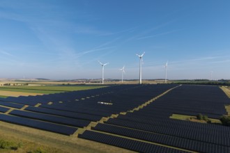 Extensive field with solar cells and wind turbines in rural area, near Kitzingen, Lower Franconia,