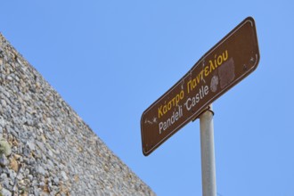 Signpost to Pandeli Castle under a clear sky, Pandeli Castle, Castle, Leros Fortress, St John's