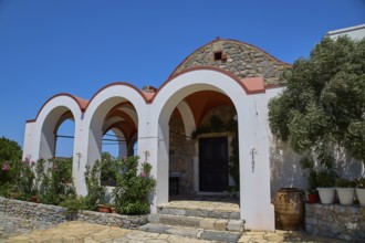 Panagia Kyra church, Panagia tou Kastrou, building with arched entrances and plants, Pandeli