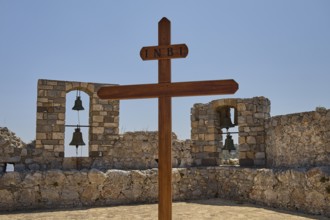 Wooden cross in front of stone bell windows, Pandeli Castle, Castle, Leros Fortress, St John's