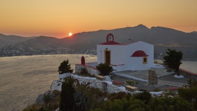Chapel on a cliff at sunset with a view of the coast and mountains, Profitis Ilias Church, Prophet