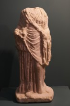Headless ancient Roman statue fragment with draped robe made of sandstone, Archaeological Museum,