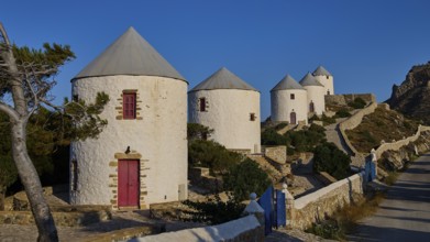 Several windmills along a winding road in natural surroundings, Pandeli Castle, Castle, Leros