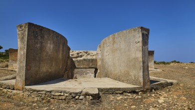 Massive concrete ruin in dry landscape with clear blue sky, Lost Place, Air Defence Position,