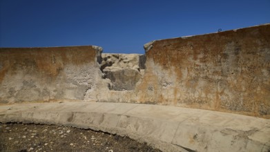 Erosion on concrete wall of an old ruin under blue sky, Lost Place, Air Defence Position,