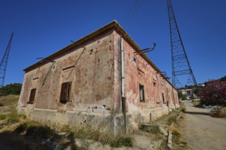 Lost Place, Old building with rusty pipes and electricity tower under clear sky, Radio Station,
