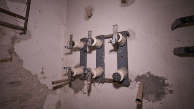 Lost Place, close-up of old electrical connections in a dilapidated building, Radio Station, WW2,