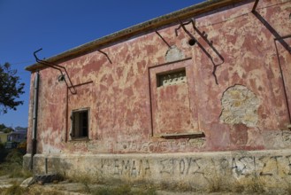 Lost Place, Dilapidated building with red walls, graffiti and a window under a blue sky, Radio