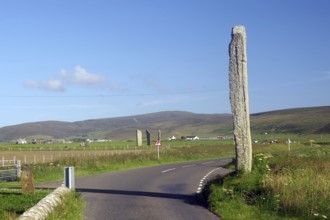 High stone next to a road with hills in the background, Ring of Brodgar, stone circle, Mainland,