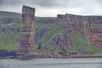 Imposing rock formations on a coastline look dramatic and sublime, Old Men of Hoy, landmark, Orkney