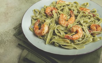Tagliatelle with spinach, in cream sauce, with shrimp, homemade, no people