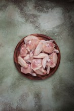 Raw chicken wings, on a wooden board, top view, no people