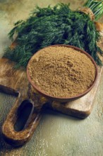 Dried dill, in a ceramic bowl, a bunch of fresh dill, seasoning, top view, no people